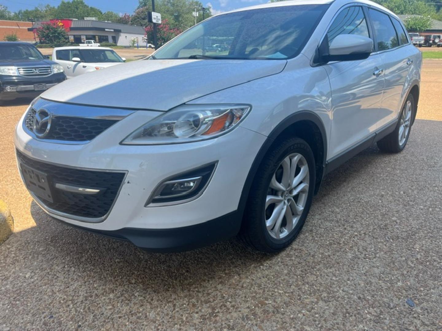 2012 WHITE MAZDA CX-9 GRAND TOURING Grand Touring (JM3TB2DA3C0) with an 3.7L V6 DOHC 24V engine, 6-Speed Automatic transmission, located at 922 W. Beacon St., Philadelphia, MS, 39350, (601) 650-3675, 32.770447, -89.127151 - Title: 2012 Mazda CX-9 Grand Touring Year: 2012 Make: Mazda Model: CX-9 Engine: 3.7L V6 DOHC 24V Body: SPORT UTILITY 4-DR Transmission: 6-Speed Automatic Drive Type: FWD Mpg City: 17 Mpg: 24 Trim: Grand Touring - Photo#1