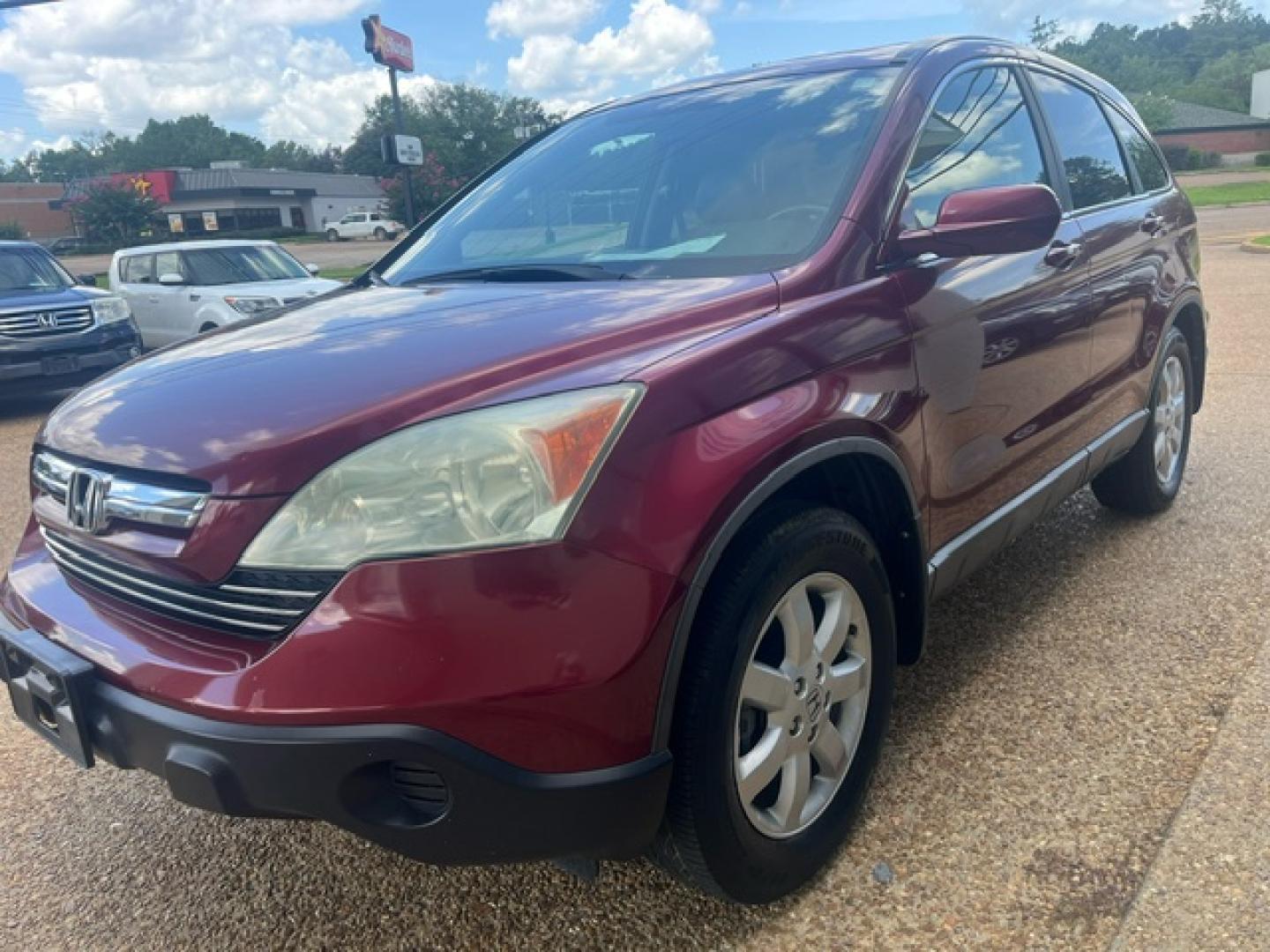 2009 RED HONDA CR-V EX-L EX-L (5J6RE38739L) with an 2.4L L4 DOHC 16V engine, 5-Speed Automatic transmission, located at 922 W. Beacon St., Philadelphia, MS, 39350, (601) 650-3675, 32.770447, -89.127151 - Title: 2009 Honda CR-V EX-L Year: 2009 Make: Honda Model: CR-V Engine: 2.4L L4 DOHC 16V Body: SPORT UTILITY 4-DR Transmission: 5-Speed Automatic Overdrive Drive Type: FWD Mpg City: 20 Mpg: 27 Trim: EX-L 2WD - Photo#2