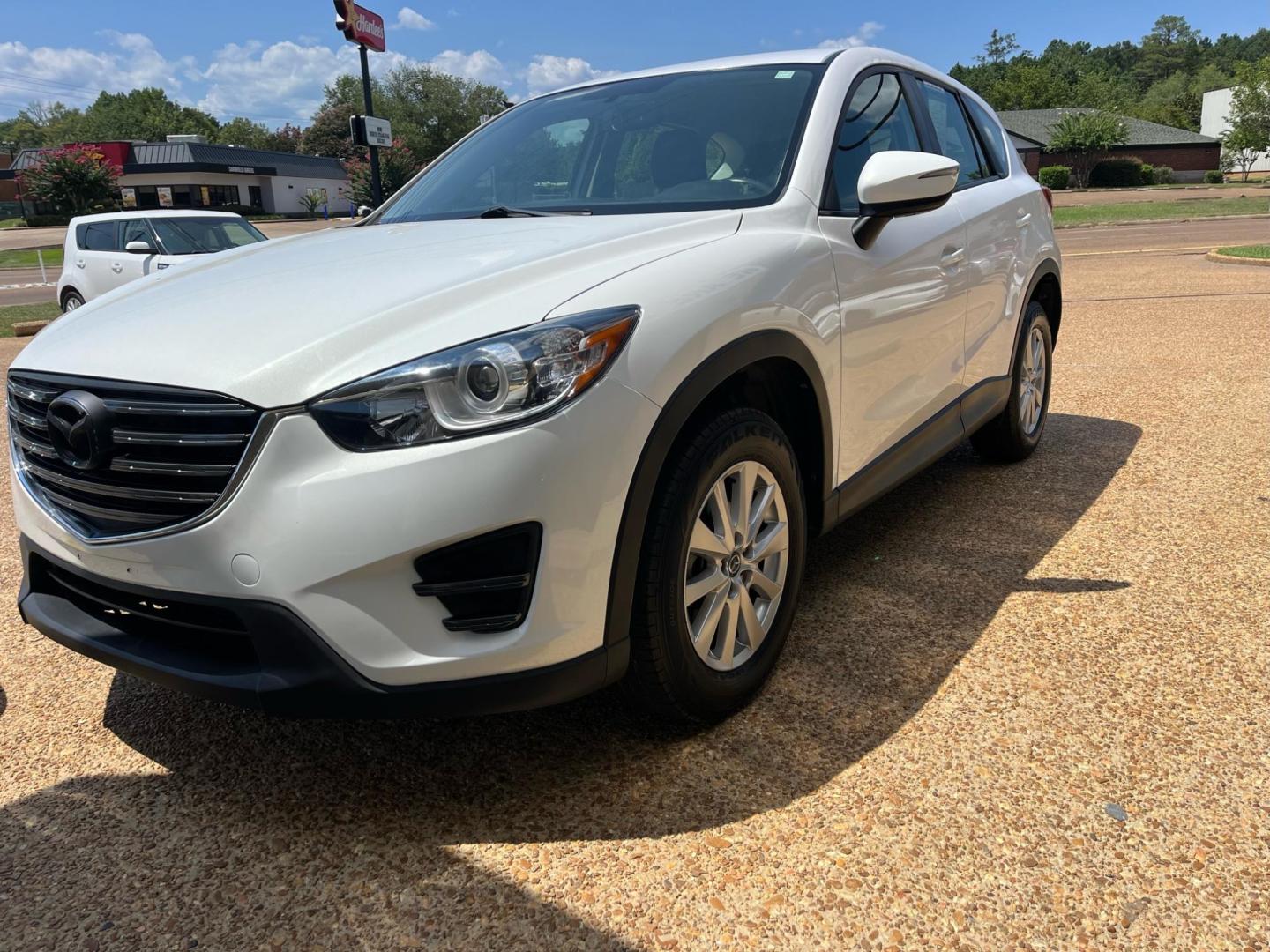 2016 WHITE /Grey MAZDA CX-5 SPORT Sport (JM3KE2BY6G0) with an 2.5L L4 DOHC 16V engine, 6-Speed Automatic transmission, located at 922 W. Beacon St., Philadelphia, MS, 39350, (601) 650-3675, 32.770447, -89.127151 - Title: 2016 Mazda CX-5 Sport AT Year: 2016 Make: Mazda Model: CX-5 Engine: 2.5L L4 DOHC 16V Body: SPORT UTILITY 4-DR Transmission: 6-Speed Automatic Drive Type: FWD Mpg City: 26 Mpg: 33 Trim: Sport AT - Photo#2