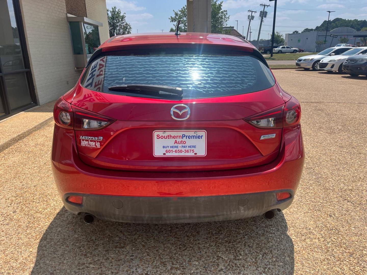 2015 RED /Black MAZDA MAZDA3 S SPORT Sport (3MZBM1K70FM) with an 2.0L L4 DOHC 16V engine, 6-Speed Automatic transmission, located at 922 W. Beacon St., Philadelphia, MS, 39350, (601) 650-3675, 32.770447, -89.127151 - Title: 2015 Mazda MAZDA3 i Sport Year: 2015 Make: Mazda Model: MAZDA 3 Engine: 2.0L L4 DOHC 16V Body: HATCHBACK 5-DR Transmission: 6-Speed automatic Drive Type: FWD Mpg City: 29 Mpg: 40 Trim: I Sport MT 5-Door - Photo#3