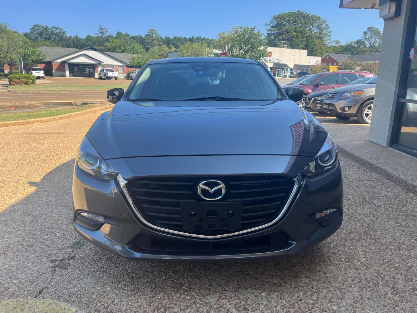 2018 GRAY /Black MAZDA MAZDA3 SPORT Sport (3MZBN1U77JM) with an 2.0L L4 DOHC 16V engine, 6-Speed Automatic transmission, located at 922 W. Beacon St., Philadelphia, MS, 39350, (601) 650-3675, 32.770447, -89.127151 - Title: 2018 Mazda 3 I Sport Year: 2018 Make: Mazda Model: 3 I Sport Engine:2.0L L4 DOHC 16V Body: SEDAN Transmission: 6 Speed Automatic Drive Type: FWD Trim: I Sport MT - Photo#2