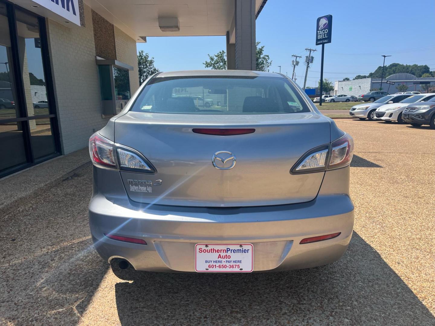 2013 GRAY MAZDA MAZDA3 I SV Sport (JM1BL1TF6D1) with an 2.0L L4 DOHC 16V engine, 6-Speed Automatic transmission, located at 922 W. Beacon St., Philadelphia, MS, 39350, (601) 650-3675, 32.770447, -89.127151 - Title: 2013 Mazda MAZDA3 I SV Year: 2013 Make: Mazda Model: MAZDA3 Engine: 2.0L L4 DOHC 16V Body: SEDAN 4-DR Transmission: 6-Speed Automatic Drive Type: FWD Mpg City: 25 Mpg: 33 Trim: I SV MT - Photo#3