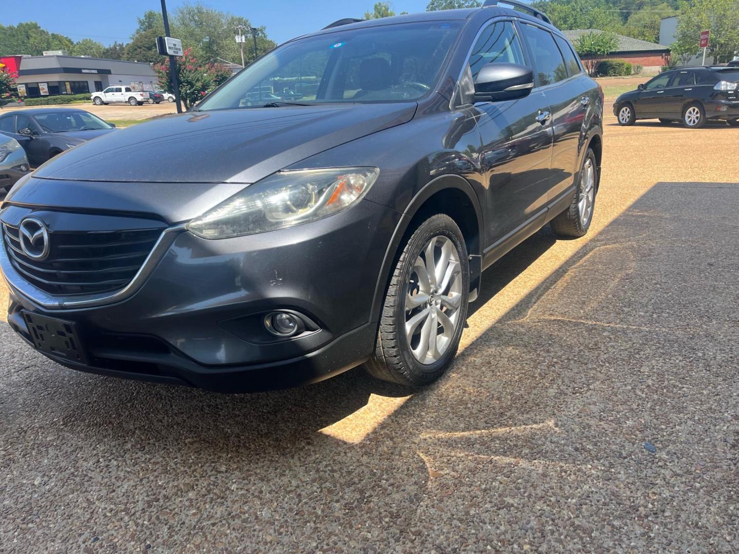 2013 GRAY MAZDA CX-9 GRAND TOURING Grand Touring (JM3TB2DAXD0) with an 3.7L V6 DOHC 24V engine, 6-Speed Automatic transmission, located at 922 W. Beacon St., Philadelphia, MS, 39350, (601) 650-3675, 32.770447, -89.127151 - Title: 2013 Mazda CX-9 Grand Touring Year: 2013 Make: Mazda Model: CX-9 Engine: 3.7L V6 DOHC 24V Body: SPORT UTILITY Transmission: 6-Speed Automatic Drive Type: FWD Mpg City: 17 Mpg: 24 Trim: Grand Touring Third Row Seating - Photo#1