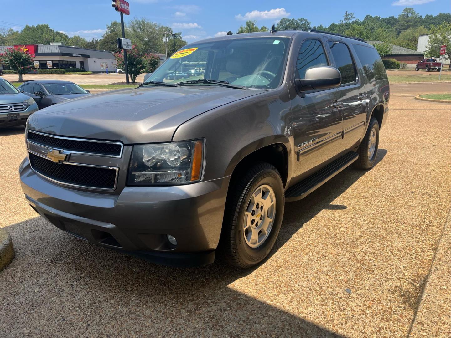 2012 BROWN CHEVROLET SUBURBAN LT LT (1GNSCJE04CR) with an 5.3L V8 OHV 16V FFV engine, 6-Speed Automatic transmission, located at 922 W. Beacon St., Philadelphia, MS, 39350, (601) 650-3675, 32.770447, -89.127151 - Title: 2012 Chevrolet Suburban LT Year: 2012 Make: Chevrolet Model: Suburban Engine:5.3L V8 OHV 16V FFV Body: SPORT UTILITY Transmission: 6-Speed Automatic Drive Type: RWD Mpg City: 15 Mpg: 21 Trim: LT Third Row Seating - Photo#2