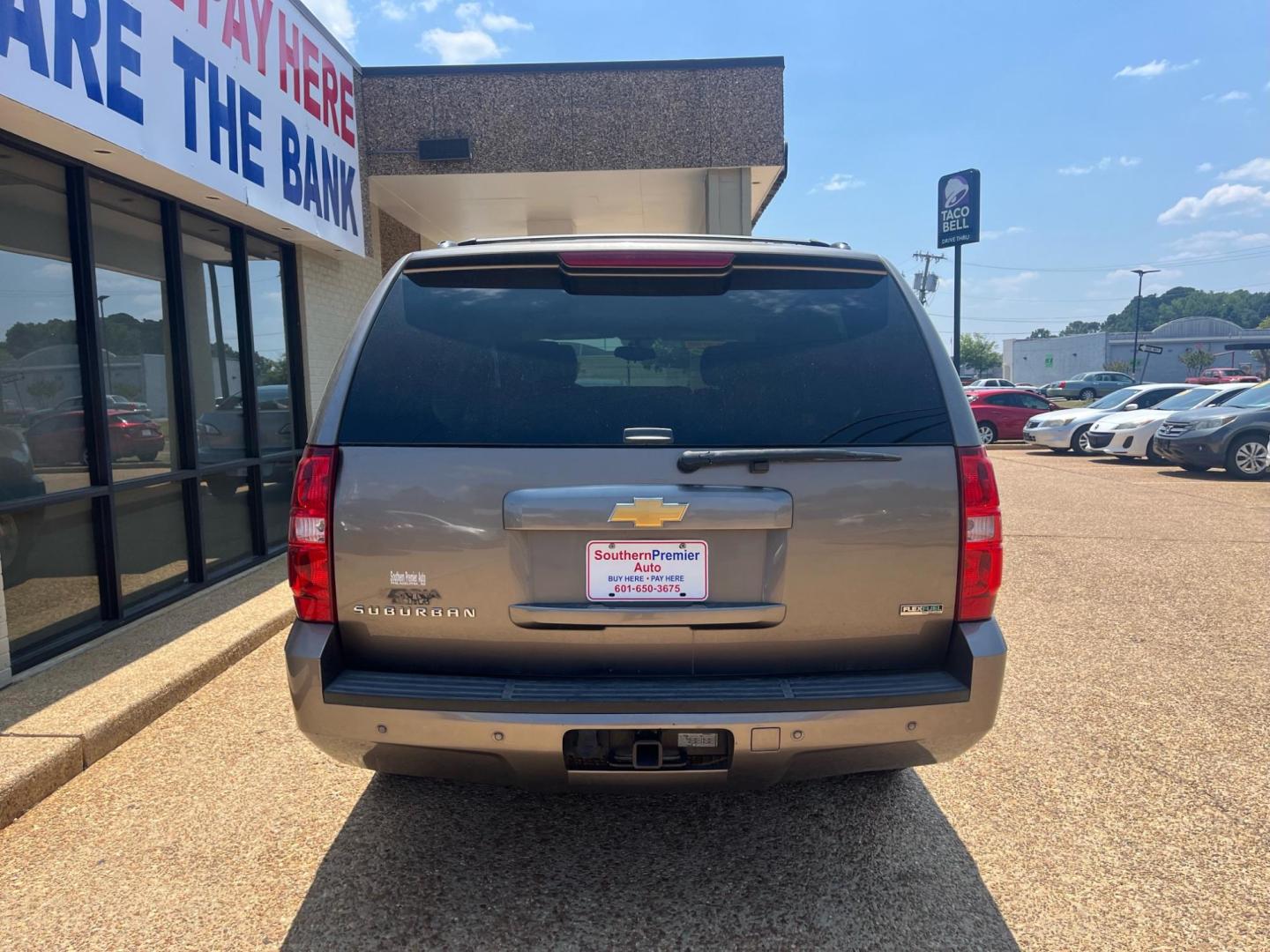 2012 BROWN CHEVROLET SUBURBAN LT LT (1GNSCJE04CR) with an 5.3L V8 OHV 16V FFV engine, 6-Speed Automatic transmission, located at 922 W. Beacon St., Philadelphia, MS, 39350, (601) 650-3675, 32.770447, -89.127151 - Title: 2012 Chevrolet Suburban LT Year: 2012 Make: Chevrolet Model: Suburban Engine:5.3L V8 OHV 16V FFV Body: SPORT UTILITY Transmission: 6-Speed Automatic Drive Type: RWD Mpg City: 15 Mpg: 21 Trim: LT Third Row Seating - Photo#3