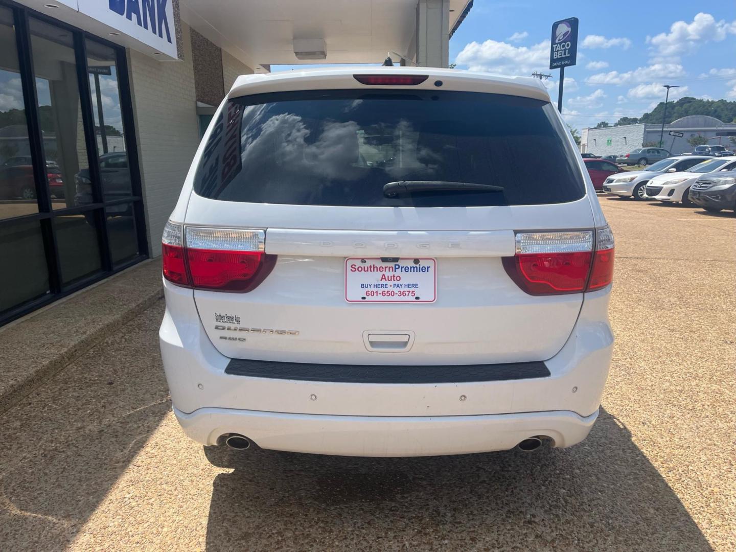 2013 WHITE /Black DODGE DURANGO SXT SXT (1C4RDJAGXDC) with an 3.6L V6 DOHC 24V engine, 5-Speed Automatic transmission, located at 922 W. Beacon St., Philadelphia, MS, 39350, (601) 650-3675, 32.770447, -89.127151 - Title: 2013 Dodge Durango SXT Year: 2013 Make: Dodge Model: Durango Engine: 3.6L V6 DOHC 24V Body: SPORT UTILITY 4-DR Transmission: 5-Speed Automatic Drive Type: AWD Mpg City: 16 Mpg: 23 Trim: SXT - Photo#3