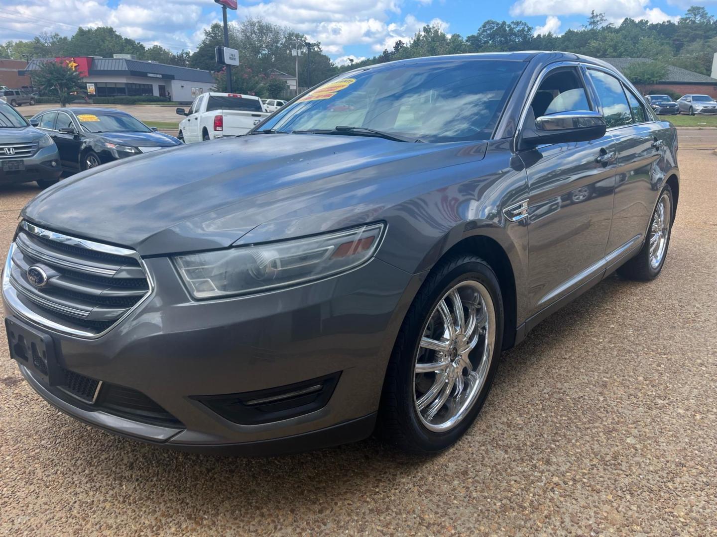 2013 GRAY /Black leather FORD TAURUS LIMITED Limited (1FAHP2F83DG) with an 3.5L V6 DOHC 24V engine, 6-Speed Automatic transmission, located at 922 W. Beacon St., Philadelphia, MS, 39350, (601) 650-3675, 32.770447, -89.127151 - Title: 2013 Ford Taurus Limited Year: 2013 Make: Ford Model: Taurus Engine: 3.5L V6 DOHC 24V Body: SEDAN 4-DR Transmission: 6-Speed Automatic Drive Type: FWD Mpg City: 19 Mpg: 29 Trim: Limited - Photo#2