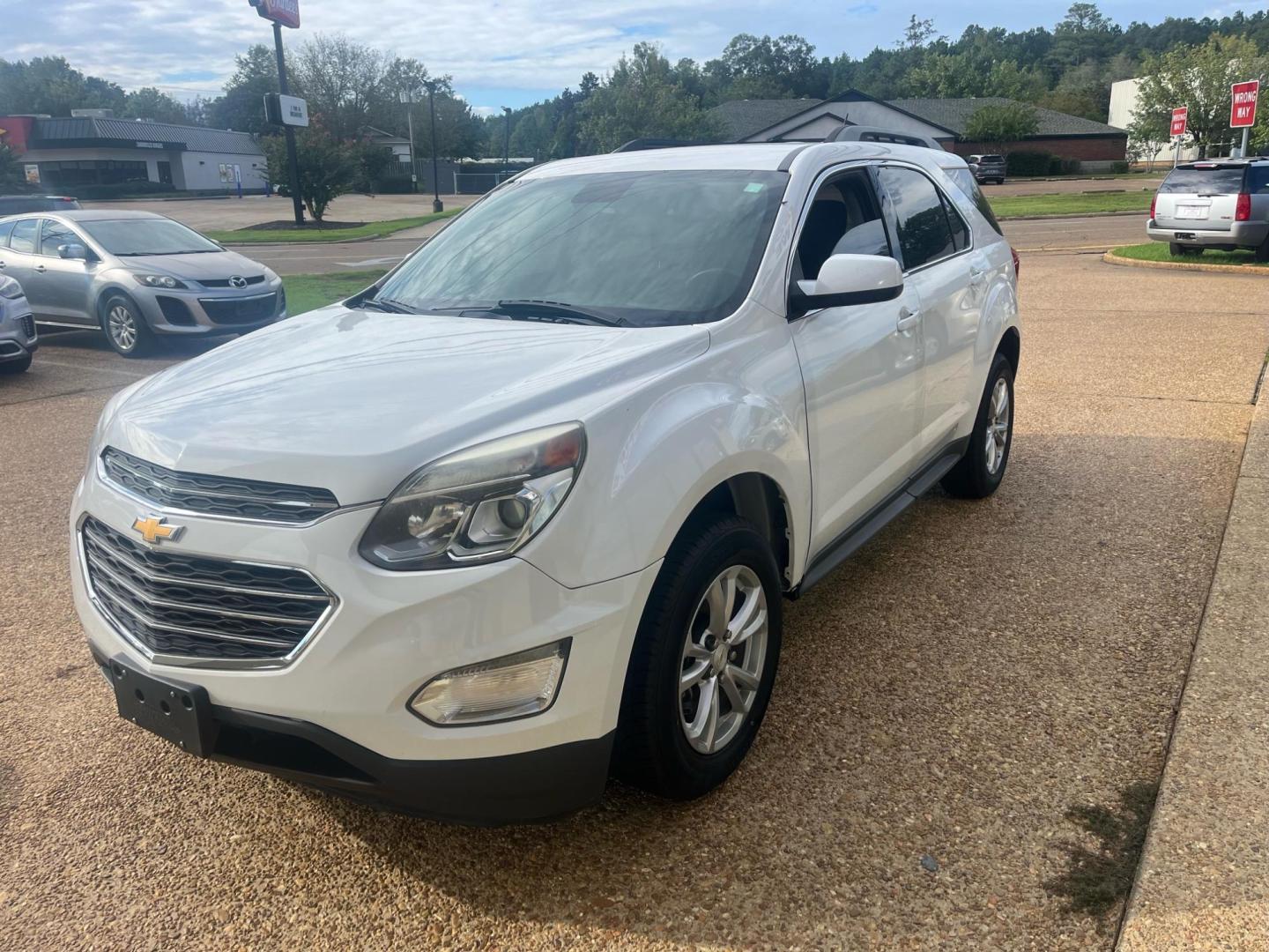 2016 WHITE CHEVROLET EQUINOX LT LT (2GNALCEK2G1) with an 2.4L L4 DOHC 16V engine, 6-Speed Automatic transmission, located at 922 W. Beacon St., Philadelphia, MS, 39350, (601) 650-3675, 32.770447, -89.127151 - Title: 2016 Chevrolet Equinox LT 2WD Year: 2016 Make: Chevrolet Model: Equinox Engine: 2.4L L4 DOHC 16V FFV Body: SPORT UTILITY 4-DR Transmission: 6A Drive Type: FWD Mpg City: 22 Mpg: 32 Trim: LT 2WD - Photo#2