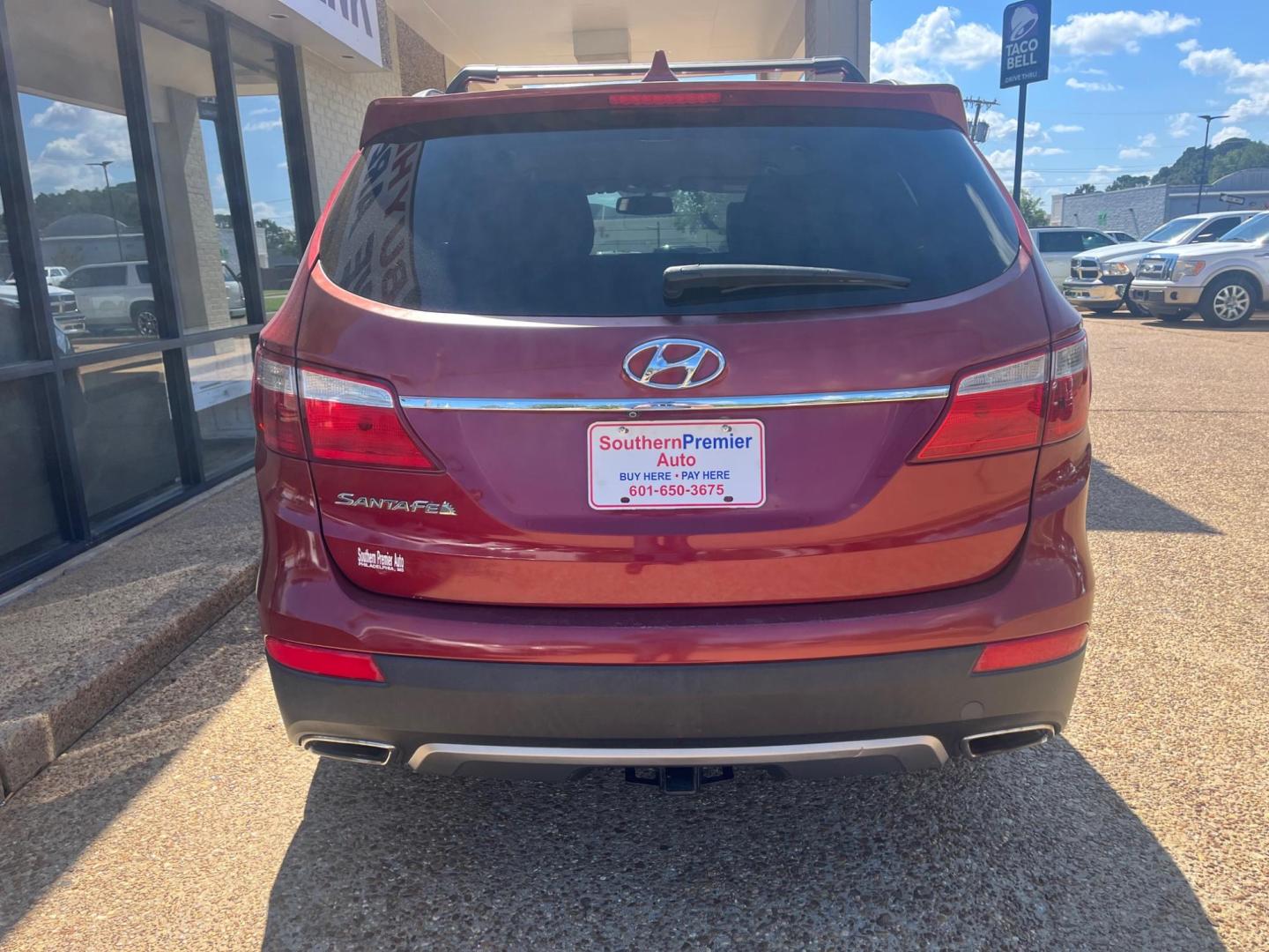 2014 RED HYUNDAI SANTA FE XL GLS; LIM Limited (KM8SN4HF5EU) with an 3.3L V6 DOHC 24V engine, 6-Speed Automatic transmission, located at 922 W. Beacon St., Philadelphia, MS, 39350, (601) 650-3675, 32.770447, -89.127151 - Title: 2014 Hyundai Santa Fe GLS FWD Year: 2014 Make: Hyundai Model: Santa Fe Engine: 3.3L V6 DOHC 24V Body: SPORT UTILITY 4-DR Transmission: 6-Speed Automatic Drive Type: FWD Mpg City: 18 Mpg: 25 Trim: GLS FWD - Photo#3