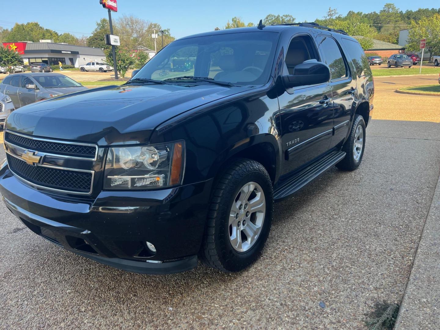 2012 BLACK /Tan leather CHEVROLET TAHOE LT LT (1GNSCBE07CR) with an 5.3L V8 OHV 16V FFV engine, 6-Speed Automatic transmission, located at 922 W. Beacon St., Philadelphia, MS, 39350, (601) 650-3675, 32.770447, -89.127151 - Title: 2012 Chevrolet Tahoe LT Year: 2012 Make: Chevrolet Model: Tahoe Engine: 5.3L V8 OHV 16V FFV Body: SPORT UTILITY 4-DR Transmission: 6-Speed Automatic Drive Type: RWD Mpg City: 15 Mpg: 21 Trim: LT - Photo#2