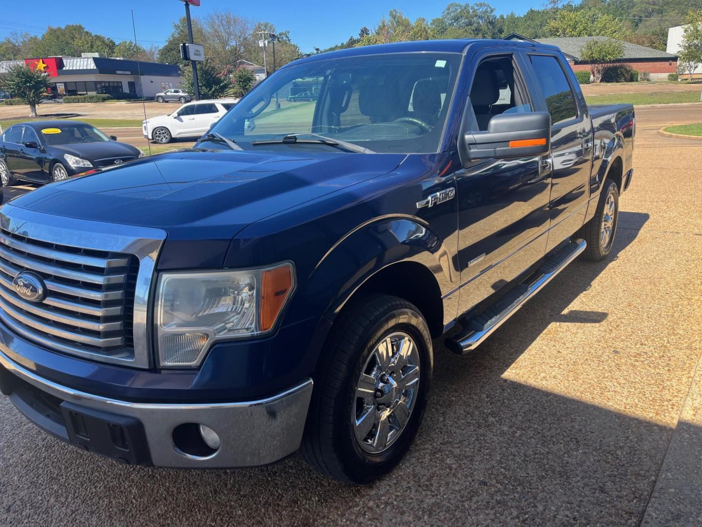 2012 BLUE FORD F-150 XL; PLATINUM; XL (1FTFW1CTXCF) with an 3.5L V6 TURBO engine, 6-Speed Automatic transmission, located at 922 W. Beacon St., Philadelphia, MS, 39350, (601) 650-3675, 32.770447, -89.127151 - Title: 2012 Ford F-150 Platinum Super Crew 6.5-ft. Bed Year: 2012 Make: Ford Model: F-150 Engine: 3.5L V6 TURBO Body: CREW CAB PICKUP 4-DR Transmission: 6-Speed Automatic Drive Type: RWD Mpg City: 16 Mpg: 22 Trim: Platinum Super Crew 6.5-ft. Bed - Photo#2